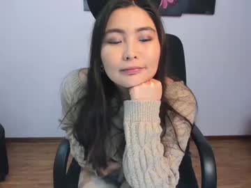 Rei Aimi wears a winter coat while sucking on a love tool